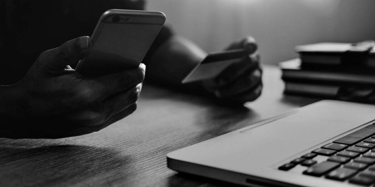 Man typing laptop and using smartphone for online shopping and pay by credit card, Online payment and shopping concept.